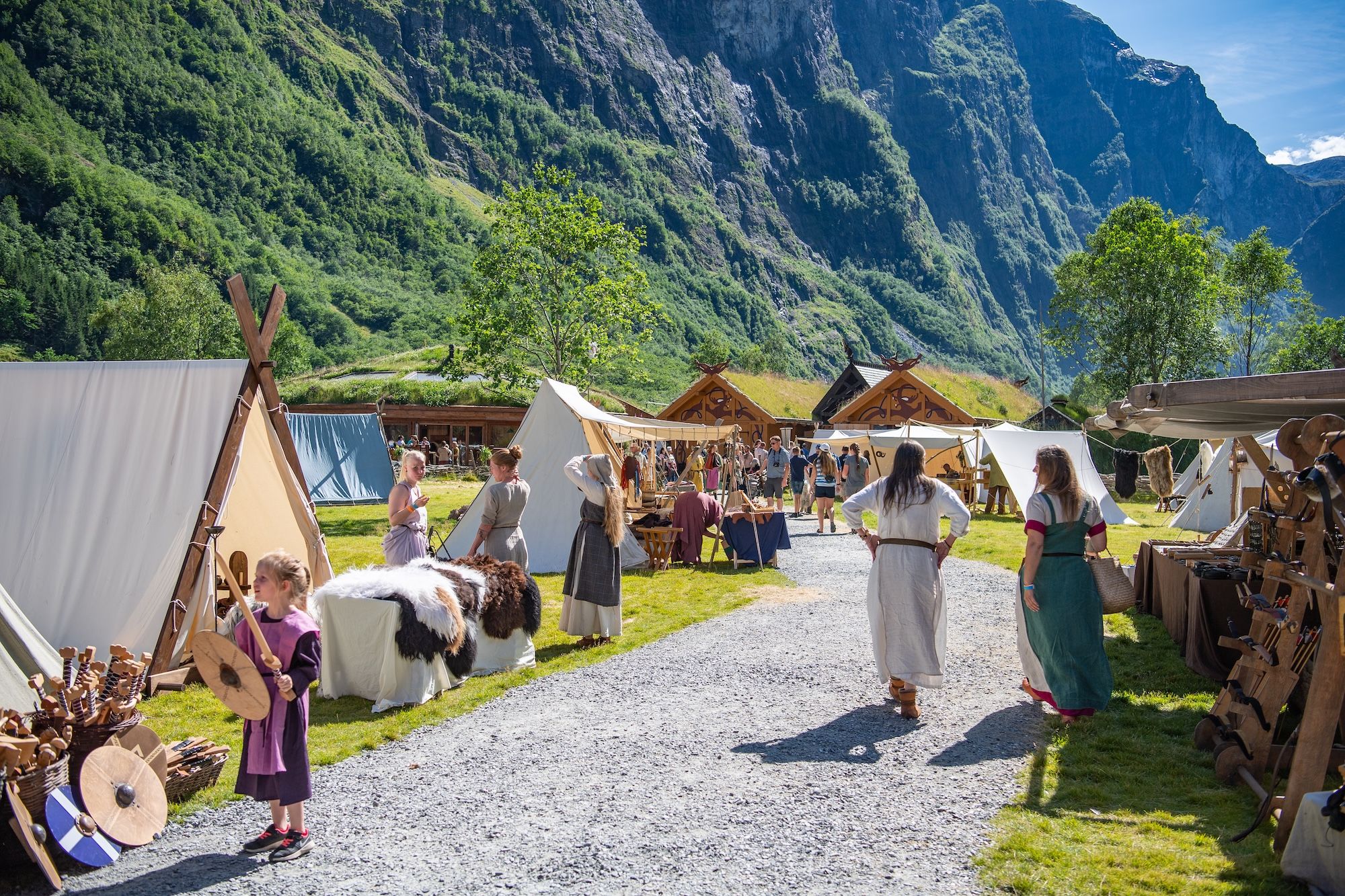 People dressed in old fashion viking clothes in a viking village.