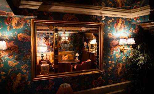 The interior of a hotel with dim lighting.