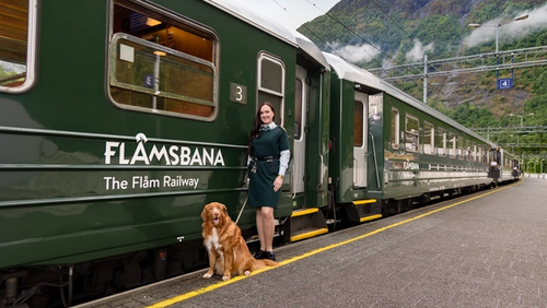 Woman and dog outside Flåmsbana