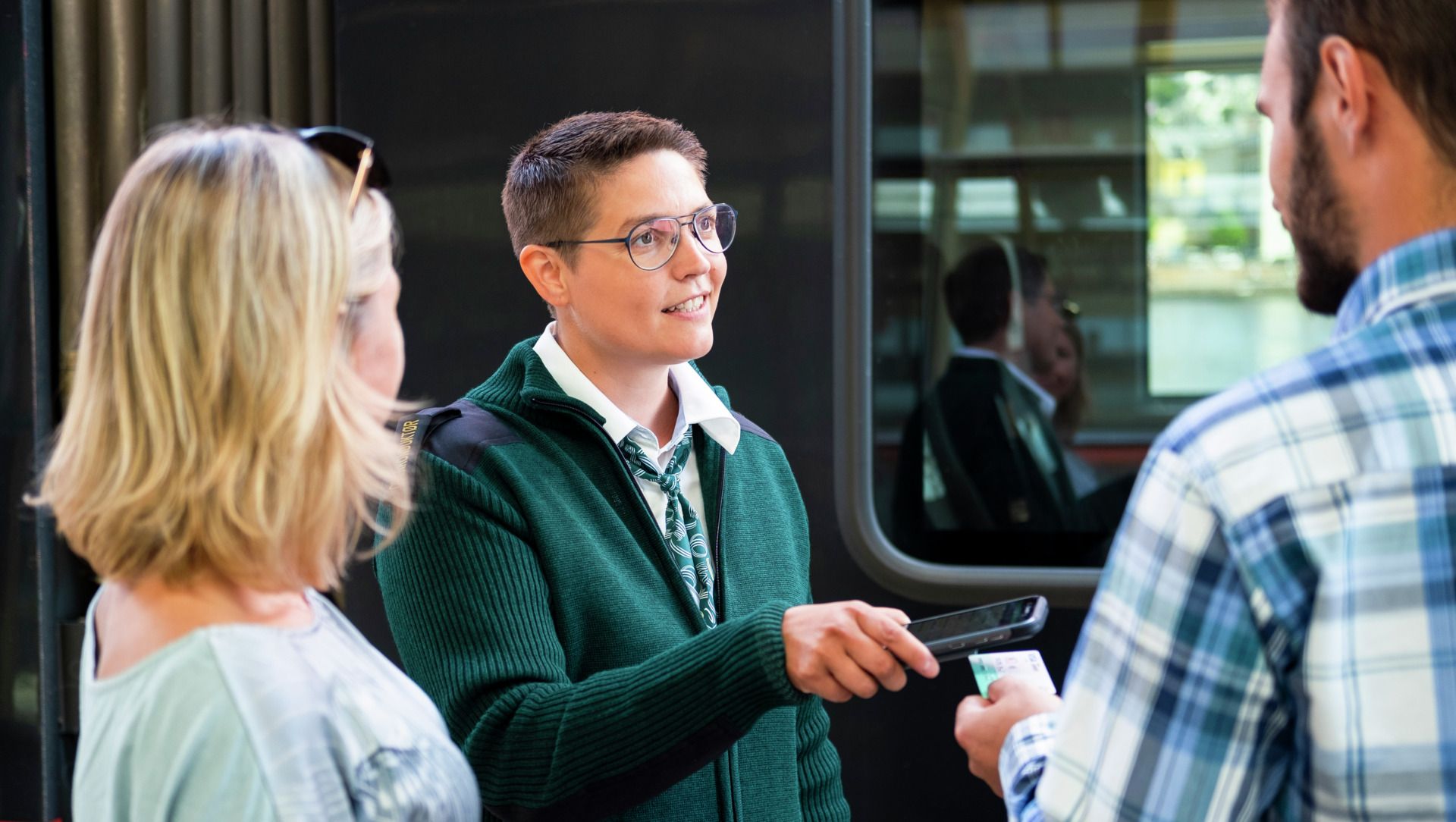 Conductor talking with passangers