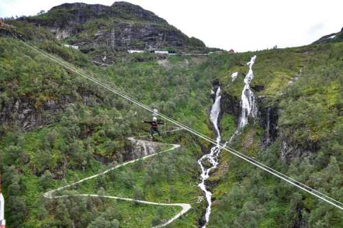 Zipline over a bike path in the mountains.