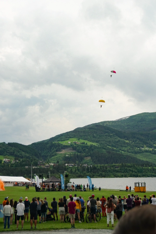 View of mountains and two people skydiving