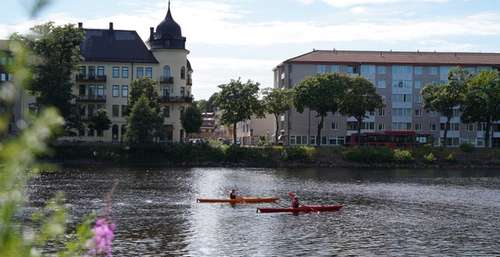 Two people canoeing on the Klarälven River in Karlstad